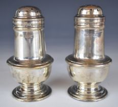 Pair of George V hallmarked silver peppers, London 1919, maker Harry Freeman, height 10cm, weight