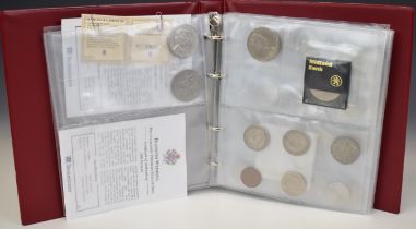 An amateur coin collection contained in an album to include Tercentenary £2 coin, Kennedy half
