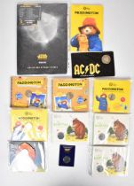 A small collection of children's characters 50p coins in Royal Mint presentation packs, includes