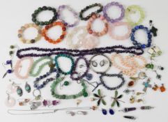 A collection of jewellery including amethyst necklace and bracelets, rose quartz bracelet, silver