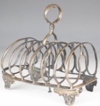 Victorian hallmarked silver seven bar toast rack with loop handle, raised on four feet, London 1839,