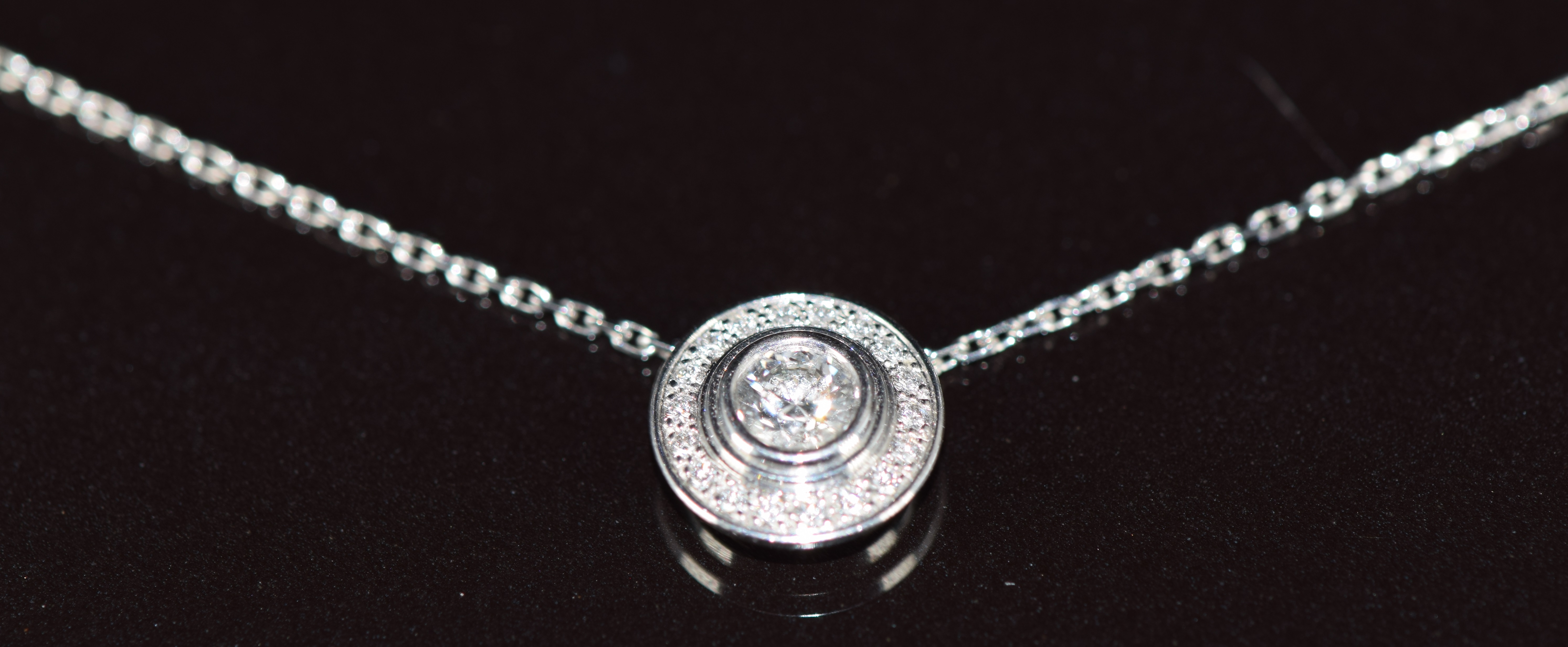 Cartier 18k white gold necklace set with diamonds, the total diamond weight approximately 0.3ct, 3.