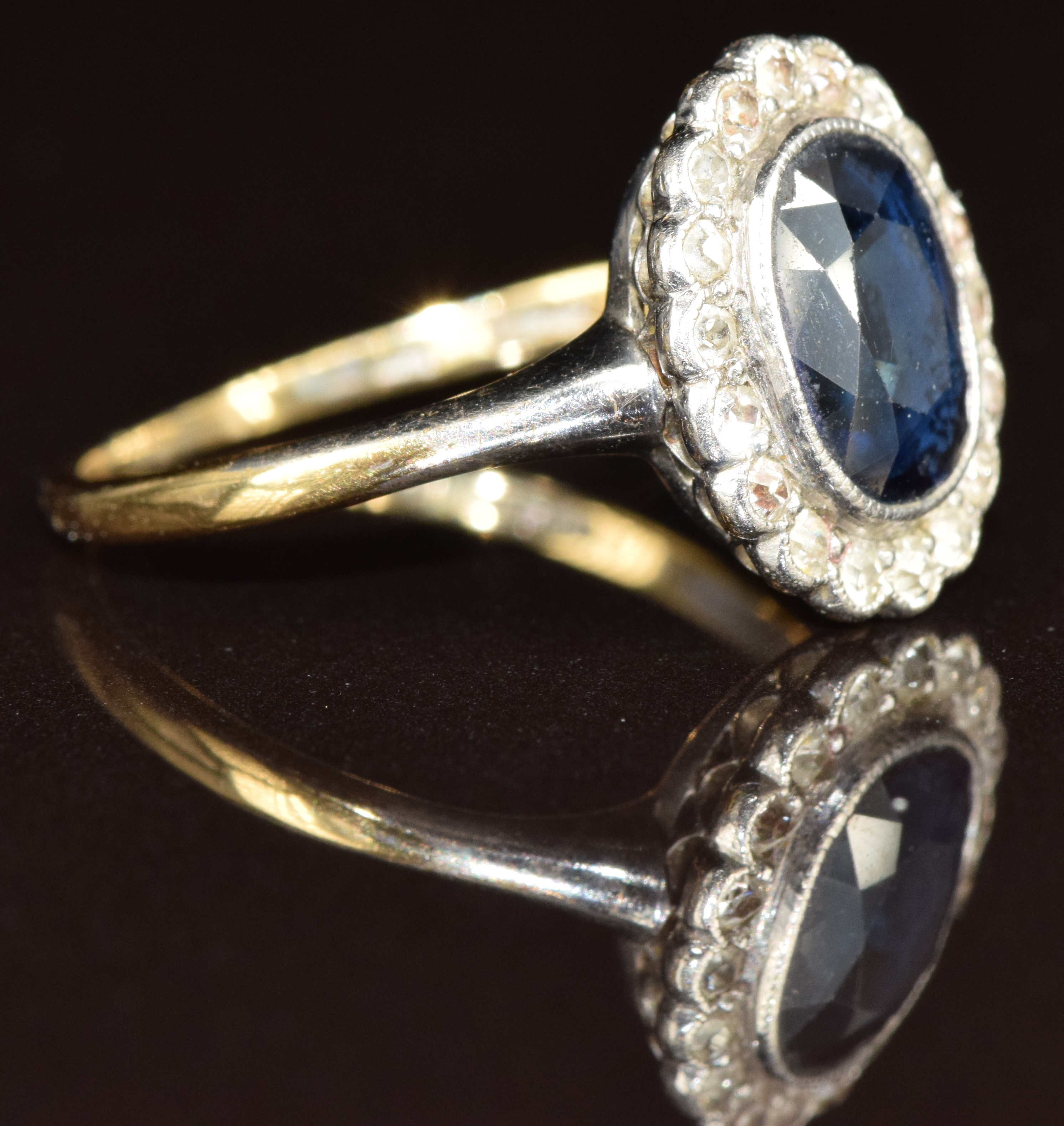 An 18ct white gold ring set with an oval cut sapphire of approximately 1.2ct surrounded by diamonds, - Image 2 of 3