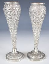 Pair of Indian or Burmese silver vases with embossed decoration, height 15cm, weight 157g