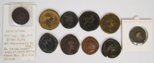 A collection of ten bronze Roman coins to include Hadrian, Nero, Maximilian etc, largest 32mm,
