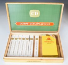 Three Montecristo Petit Tubos Cuban cigars in sealed packet, together with seven Corps