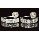 A pair of 9ct white gold earrings set with baguette cut and round cut diamonds, believed to have