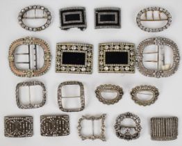 A collection of Georgian, Victorian and Art Deco buckles set with paste, including seven pairs and