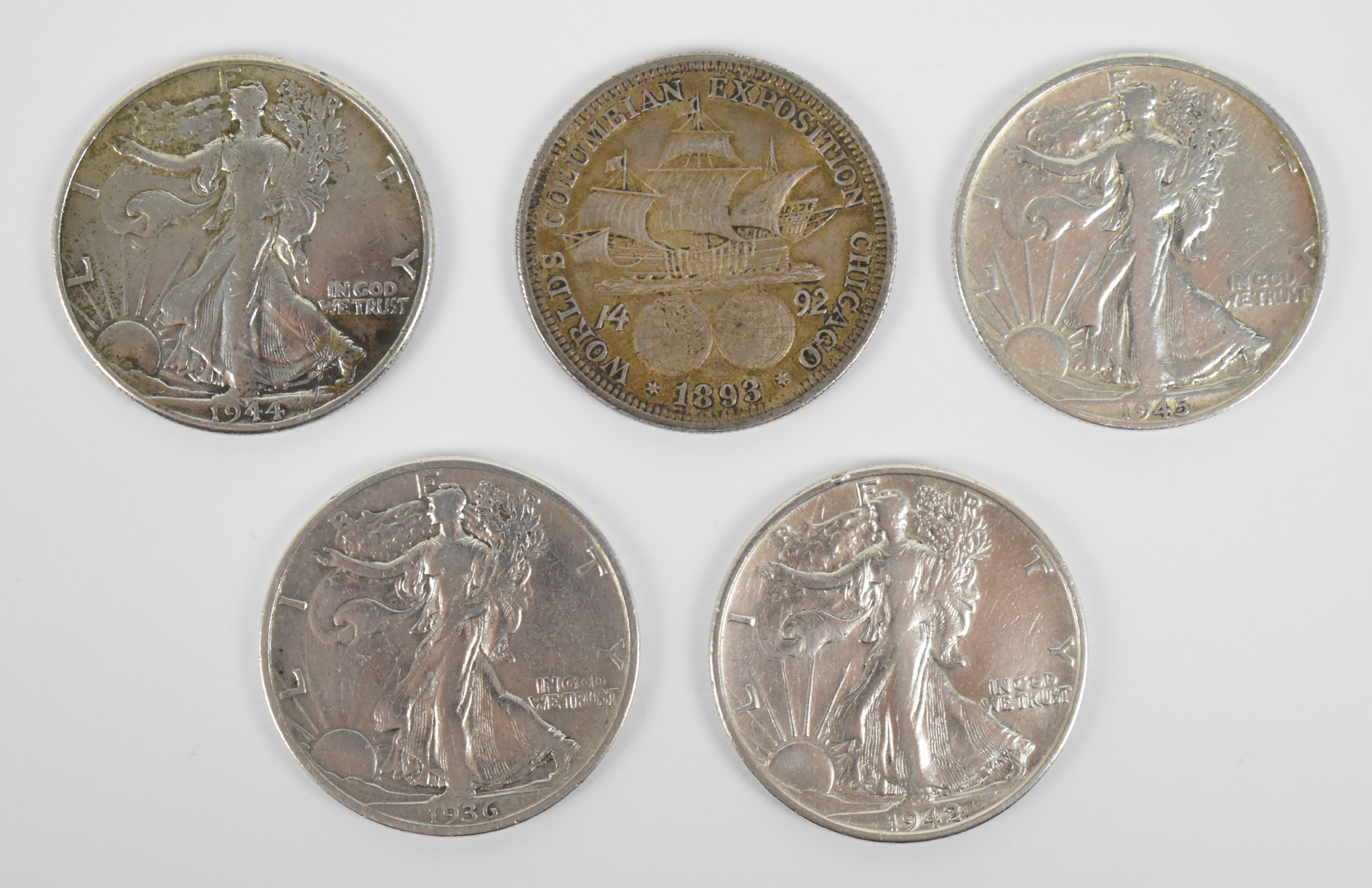 Five silver half dollars to comprising four USA 'walking Liberty' examples for 1936, 1942, 1944
