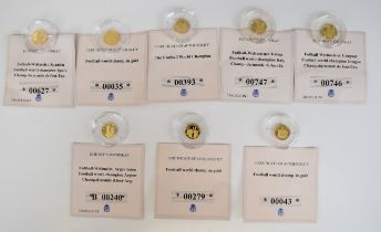 Eight limited edition 585 gold coins 'Football World Champions', each coin 0.5g, with certificates