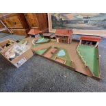 Farmyard: a wooden farmyard play base with building and a quantity of animals and related items.