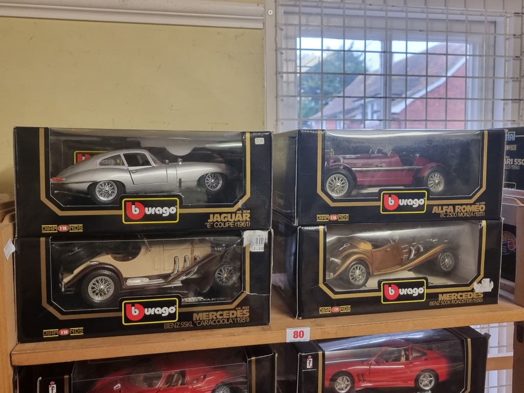 Burago: four boxed models, to include a silver E Type.