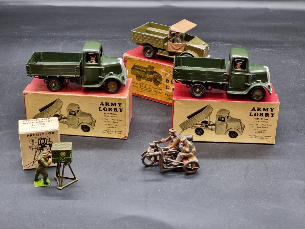 Britains: three vintage military vehicles, comprising: Army Lorry No.1334 (x2); a Beetle Lorry No.