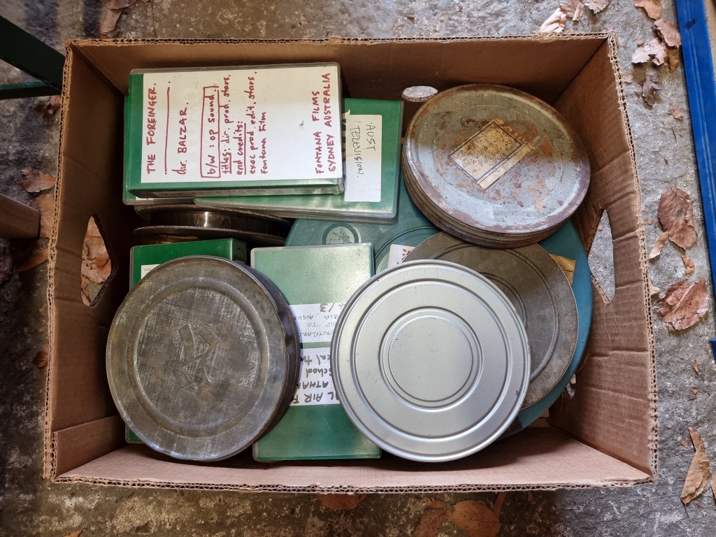 A large quantity of 16mm film reels, in tins. (4 boxes). - Image 2 of 6