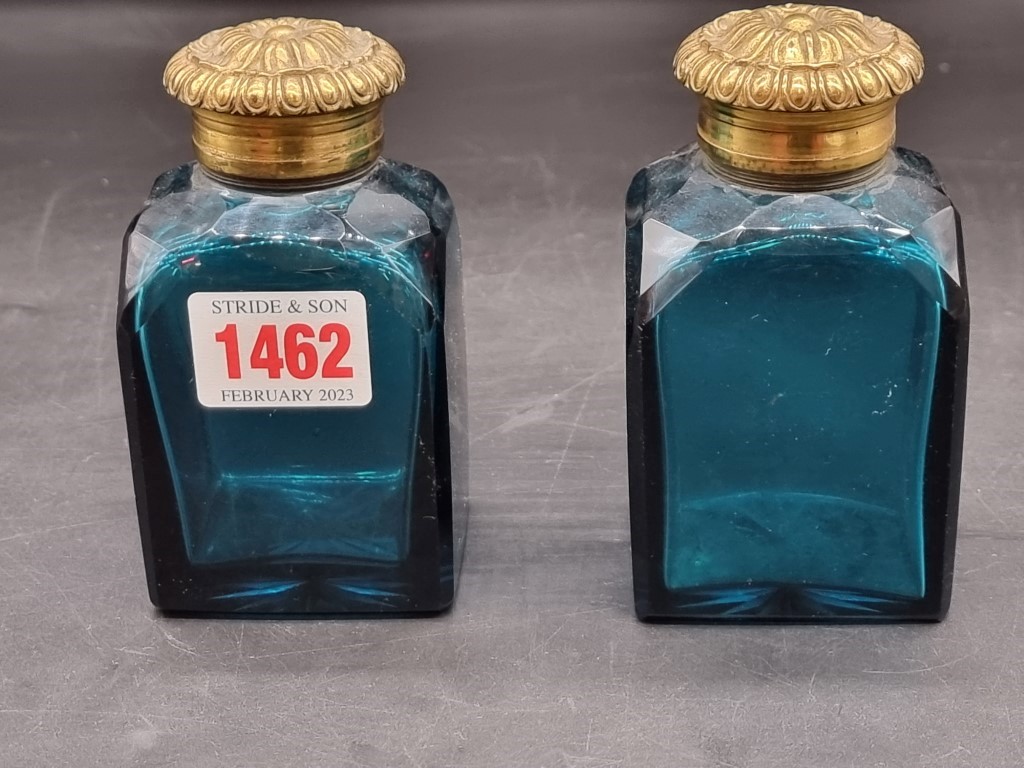 A pair of Georgian green glass and gilt brass scent bottles, 11cm high.