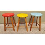 A set of three 1960s coloured seat stools, (minor variations to height), largest 46.5cm high.