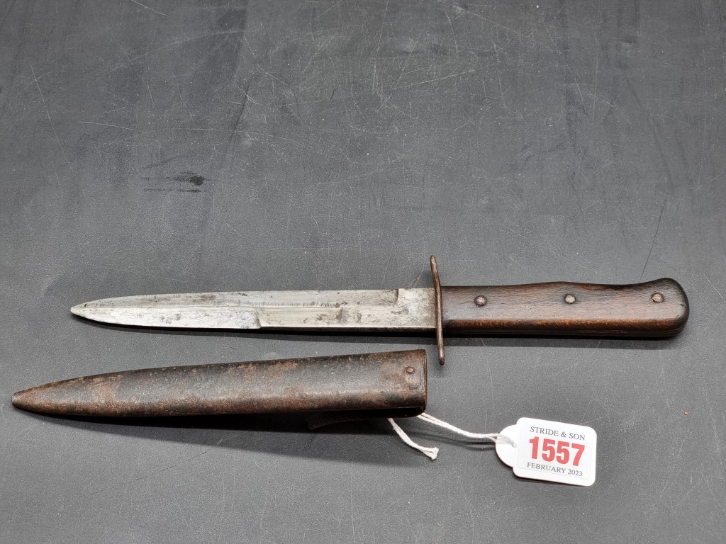 A World War II Luftwaffe boot knife and sheath, the blade inscribed '5'. - Image 2 of 3