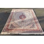 A Persian style cream and red ground carpet, 310 x 240cm