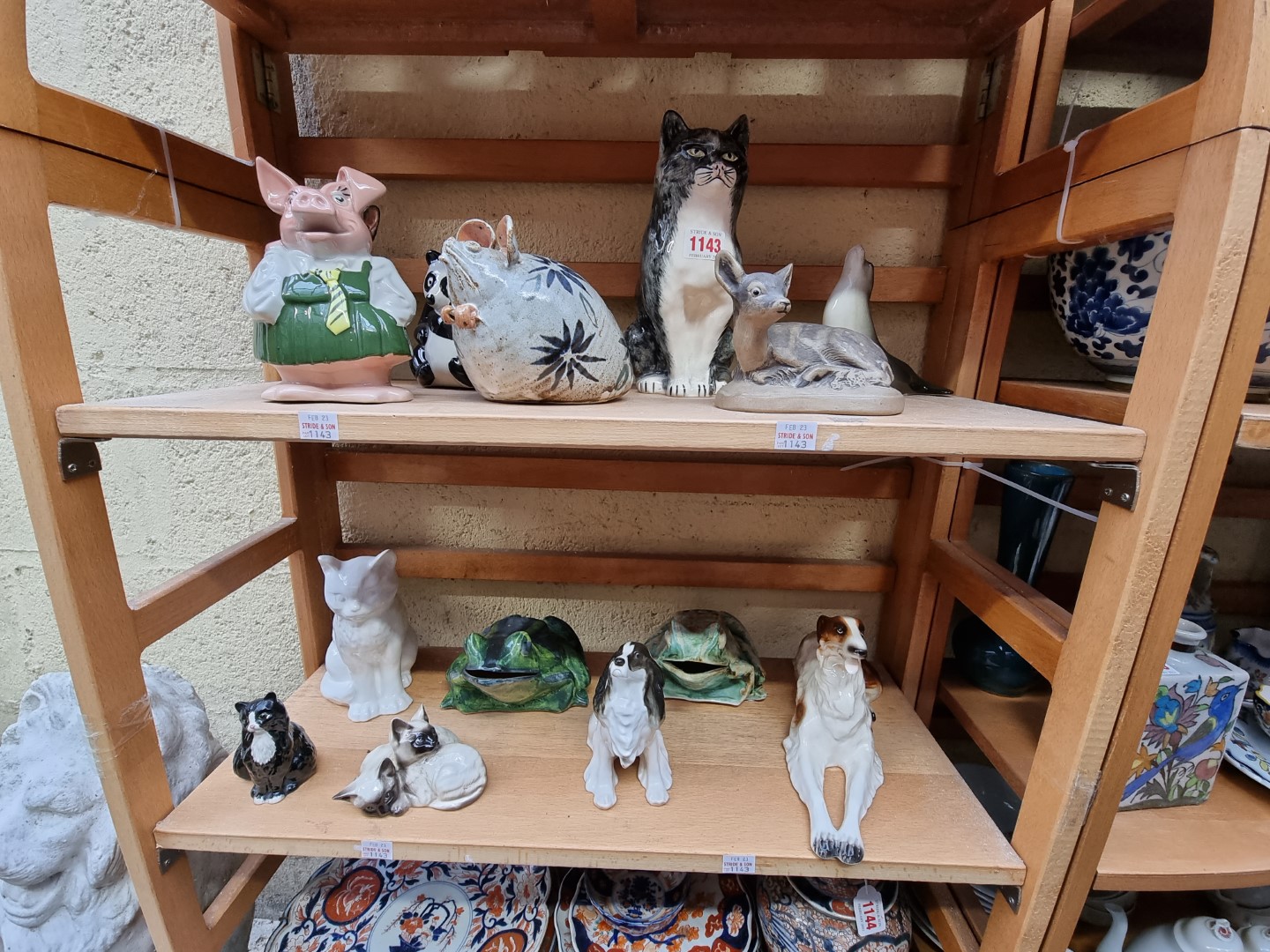 A collection of pottery animals, to include examples by Lomonosov; Beswick; Royal Doulton; Rye