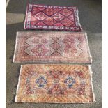 Three small rugs, 175 x 88.5cm; 147 x 80cm; and 150 x 107cm. (3)