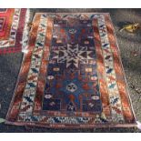 A small Persian rug, having three central medallions, with geometric borders, 142 x 92cm.