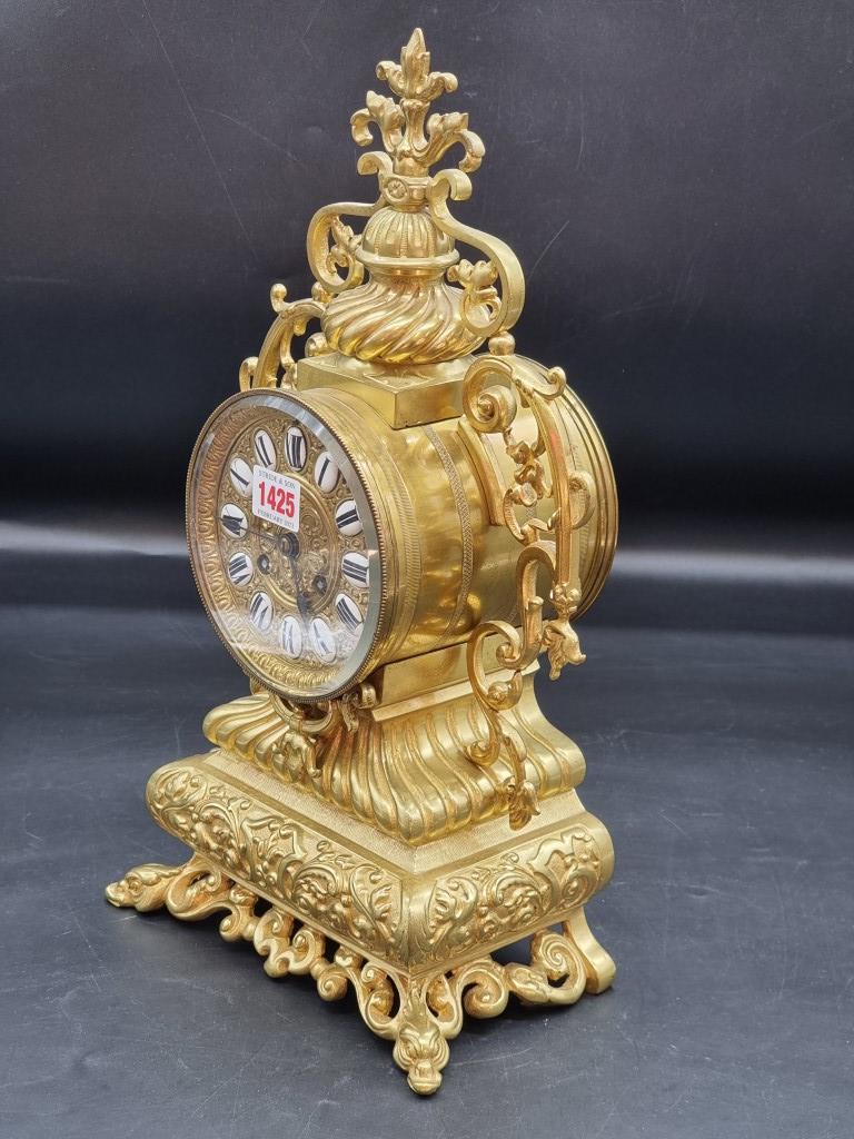 A brass mantel clock, with enamel chapter ring, 41.5cm high, with pendulum and winding key. - Image 3 of 6