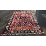 WITHDRAWN FROM SALE A Caucasian flatweave rug, having nine diamond medallions to central field,