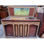 A vintage Rock-Ola 'Grand Salon' jukebox, 122cm wide.