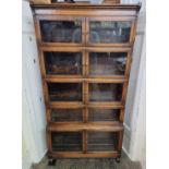 An early 20th century oak five tier sectional bookcase, 89cm wide.