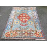 A large Turkish pale blue ground carpet, 320 x 237cm, (some staining).