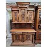 A large late 19th century Continental carved walnut side cabinet, 267.5cm high x 150cm wide x 58cm