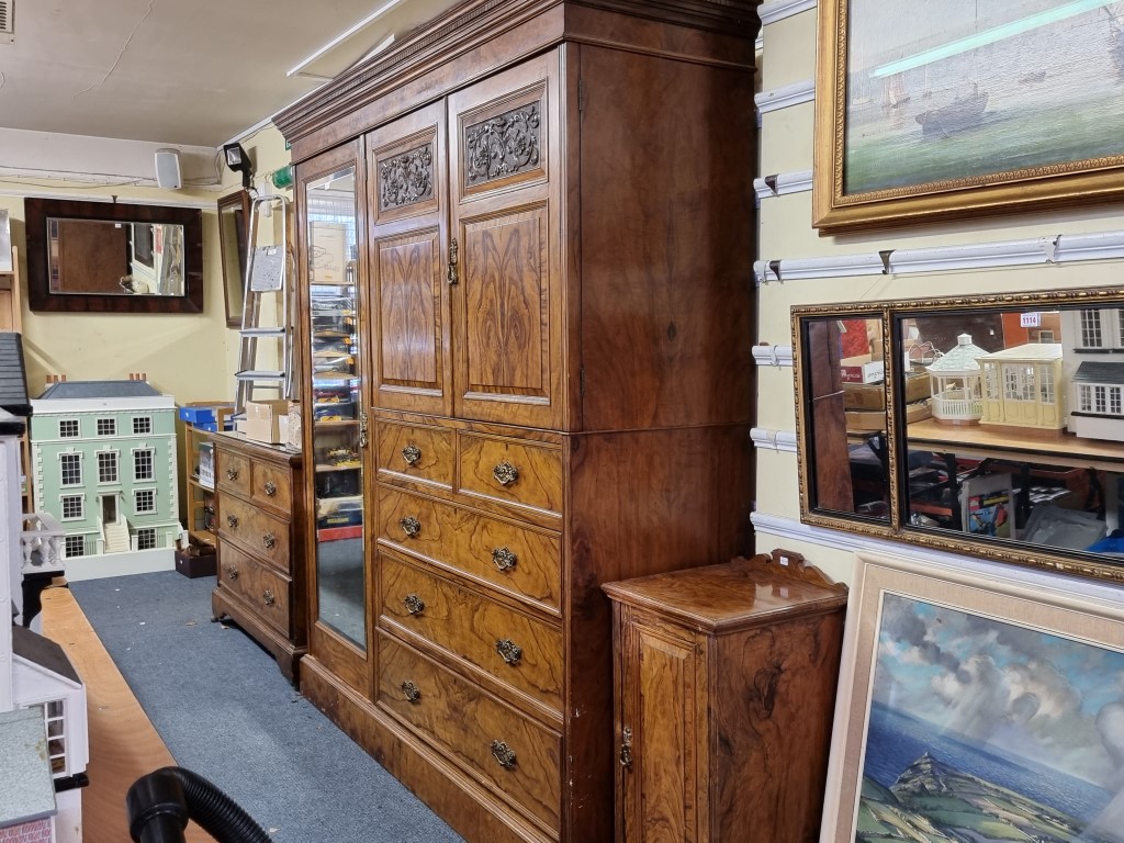 A good late Victorian figured walnut bedroom suite, comprising: a compactum style wardrobe, 195.