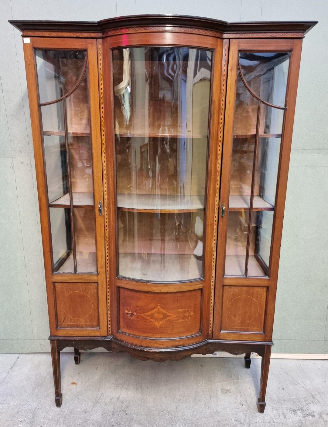 A circa 1900 mahogany and inlaid bowfront display cabinet, 114cm wide.