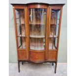 A circa 1900 mahogany and inlaid bowfront display cabinet, 114cm wide.