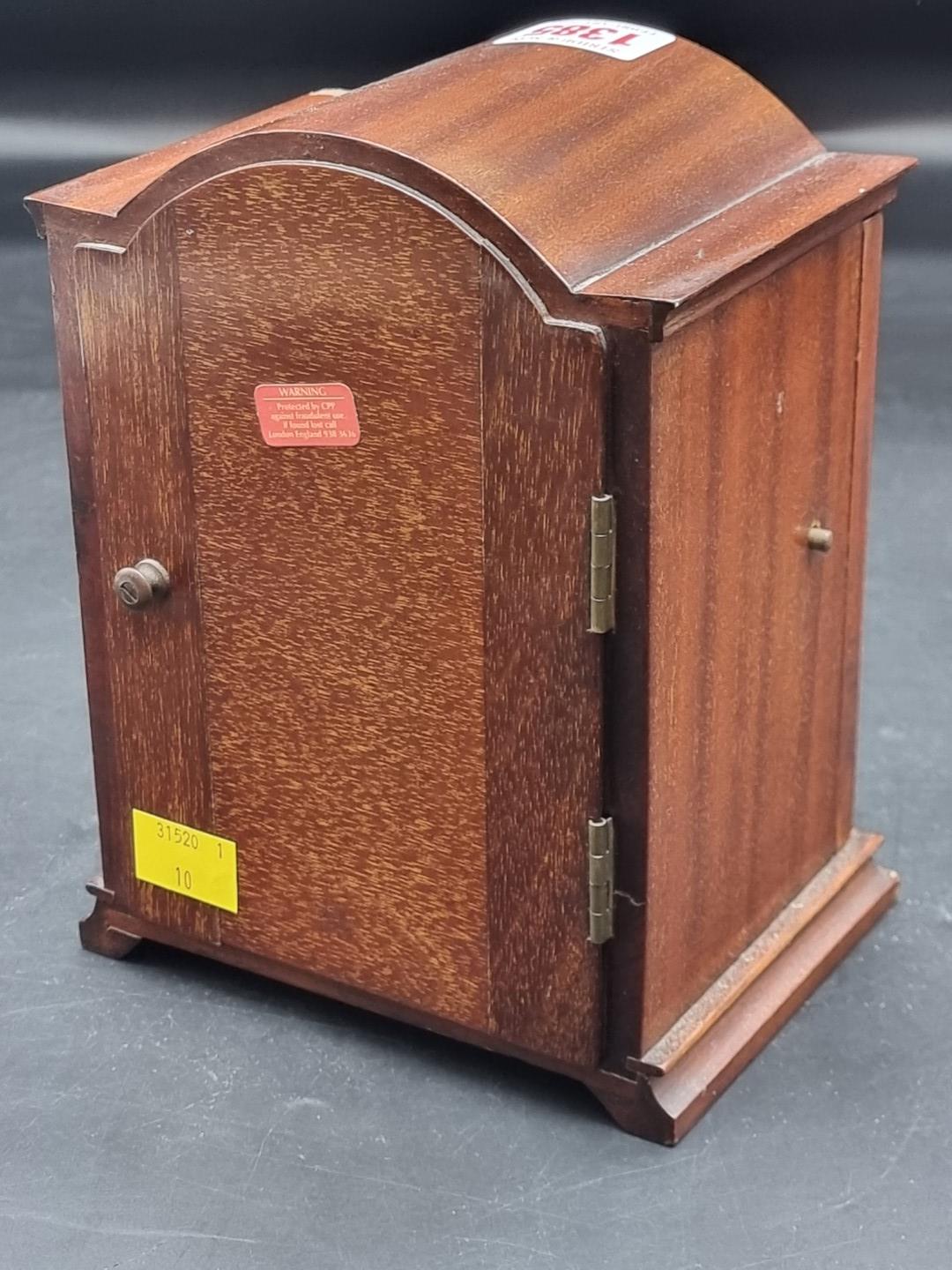 An early 20th century mahogany dome top mantel clock, with silvered dial, 18.5cm high, (chip to - Image 2 of 3