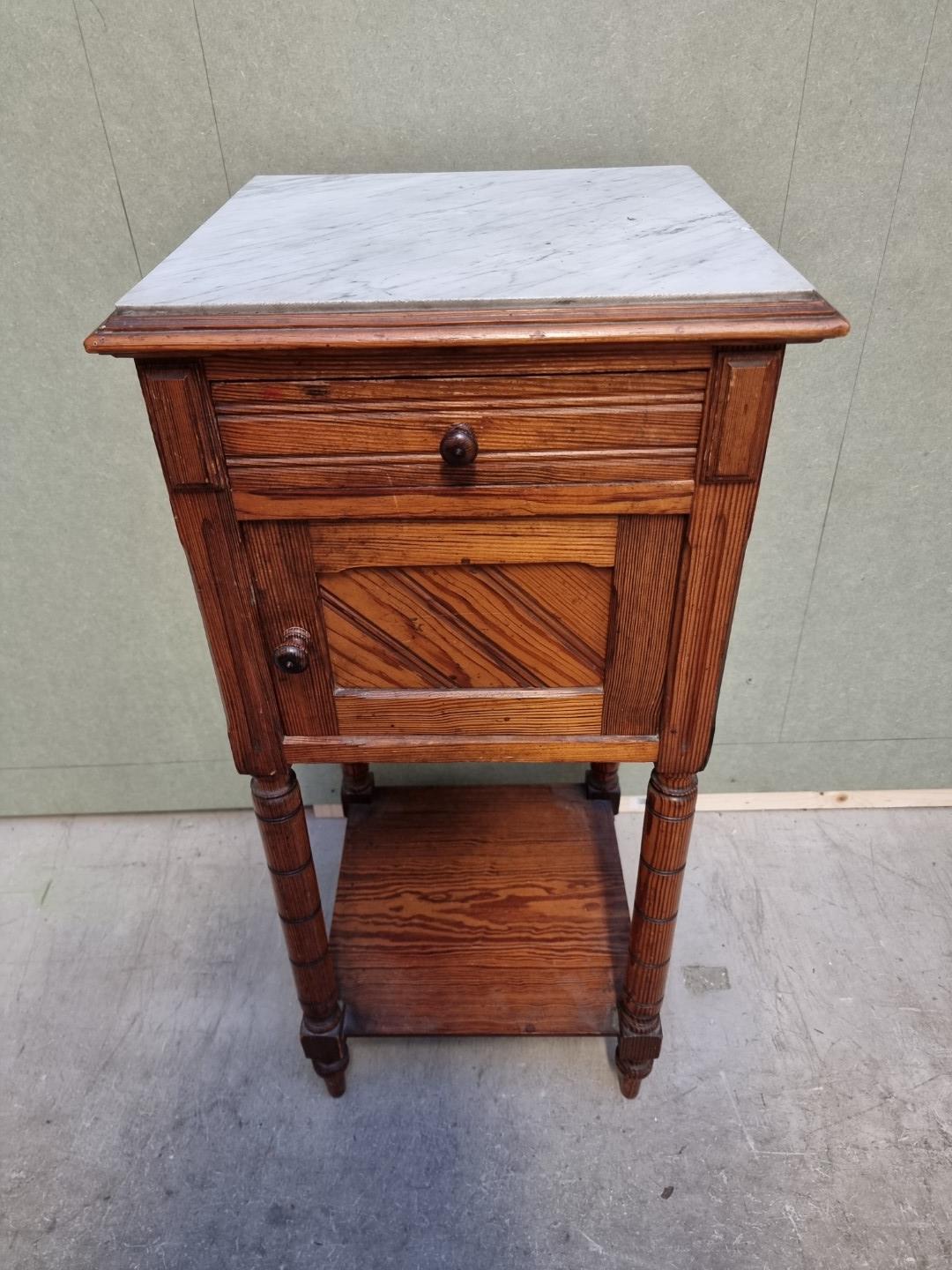 A Victorian pitch pine and marble top pot cupboard, 39.5cm wide.