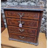 An antique miniature walnut four drawer chest, 44cm high x 41cm wide x 24.5cm deep.