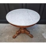 A Victorian carved mahogany and marble top circular centre table, 81cm diameter.