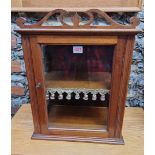 A small antique mahogany display cabinet, 51cm high x 39cm wide.
