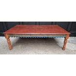 A large Eastern stained wood rectangular low occasional table, with blue painted and carved