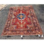 A Persian carpet, having central floral medallion, with floral cartouches to each corner, with