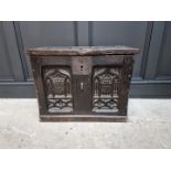 A small antique carved oak panelled coffer, possibly 16th century, with linenfold decoration to