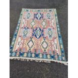 A Kelim rug, having geometric borders, 266 x 181cm.