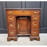 A George III oak kneehole desk, 83.5cm wide.