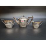 A silver three piece bachelor's tea set by William Aitken, Birmingham 1901 and Chester 1901, gross