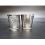 A pair of George III silver beakers, by Thomas Chawner London 1786, engraved initials, 8cm high, the