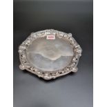 An unusual George III silver salver, having pierced border decorated four Bacchus masks with