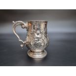 A George III silver baluster pint mug, having later embossed decoration, by Peter & Anne Bateman,