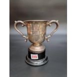 A silver twin handled trophy cup by Walker & Hall, Sheffield 1917, 12.5cm high, 255g.