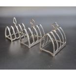 A pair of silver five bar toast racks, by Viners, Sheffield 1935, 7.5cm long; together with